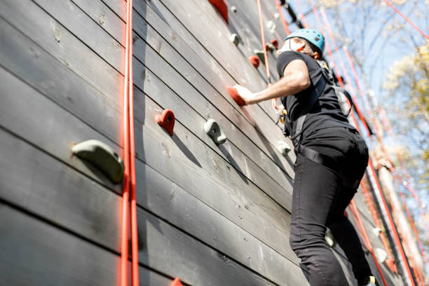 istock Man climbing the wall in the park 1288161431