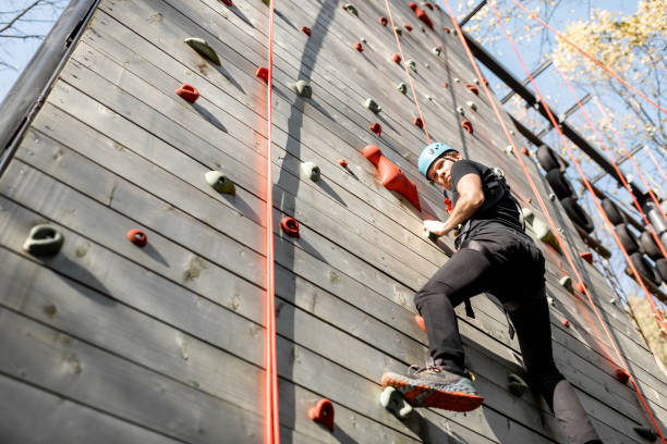 istock Man climbing the wall in the park 1288161465
