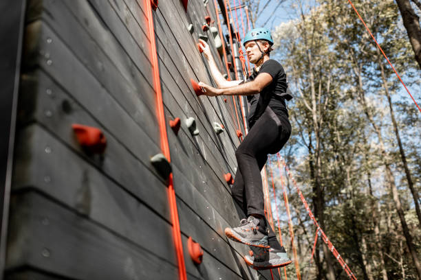 istock Man climbing the wall in the park 1288161478