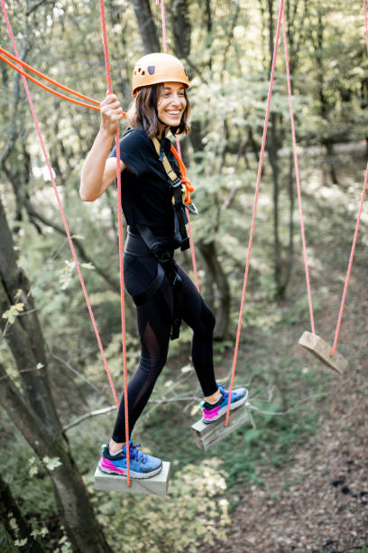 istock Woman climbing in a rope park 1288162275