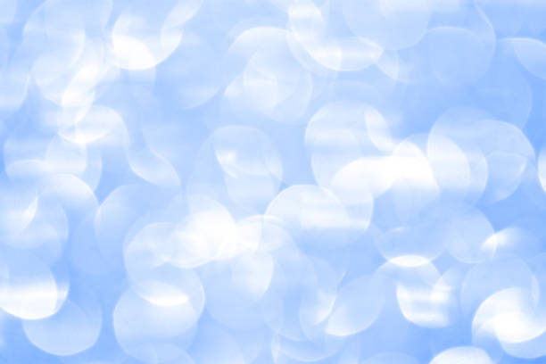 istock Beautiful Abstract Defocused Sparkle Glitter Lights Background. Pale Soft Delicate Sky blue. Shine Bokeh Effect. 1288162537