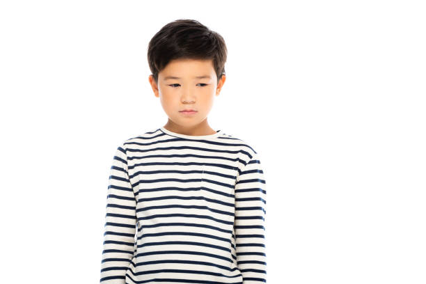 istock Sad asian child looking away isolated on white 1288162714