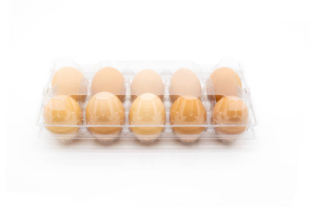 istock Organic eggs in transparent package, on white background. Freshly packaged organic egg packs 1288162737