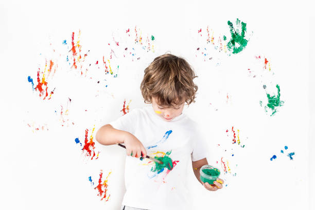 istock Boy Showing Colorful Paint on His Hands 1288169475