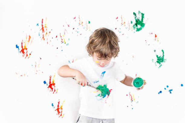 istock Boy Showing Colorful Paint on His Hands 1288169569