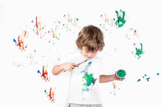 istock Boy Showing Colorful Paint on His Hands 1288169577