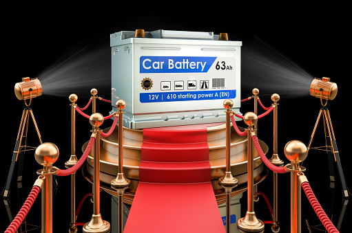 Podium with car battery, 3D rendering isolated on black background