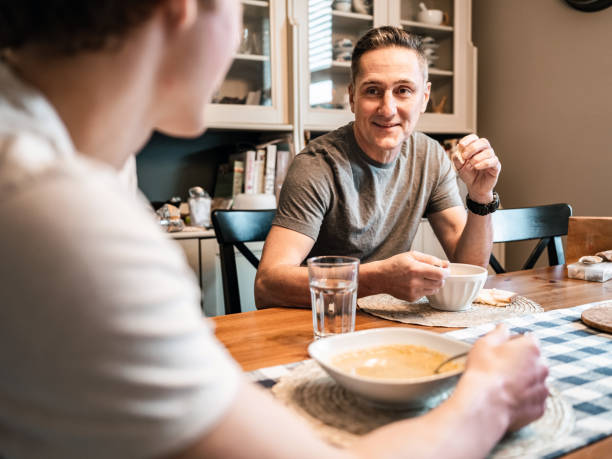 istock Father and son having lunch at home 1288171177