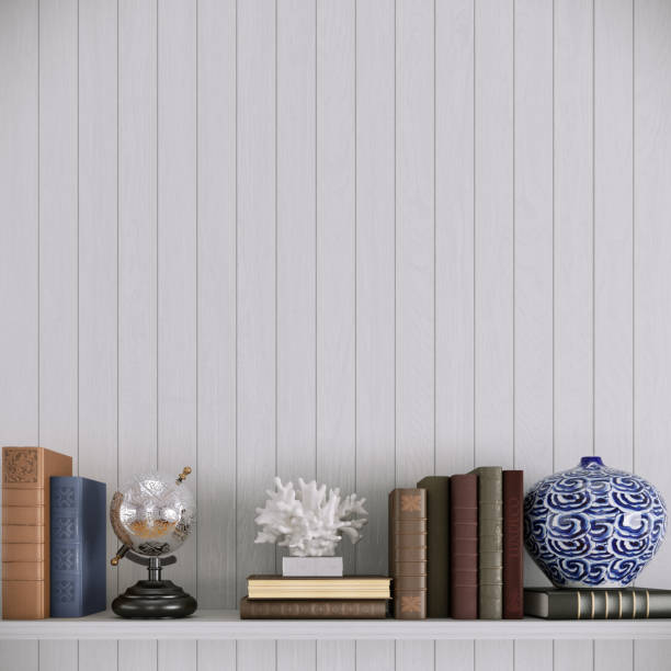 Interior design with wooden table, shelf, books, decorative accessories on white background