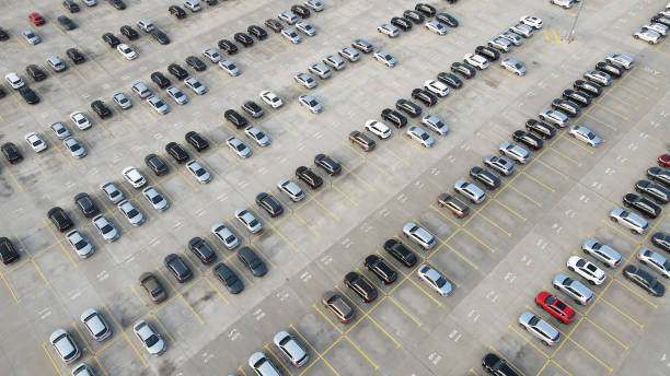 Aerial view of new cars lined up parking outside factory on car factory background. Industrial concept. Aerial view of new cars lined up parking outside factory on car factory background. bmw dealership stock pictures, royalty-free photos & images