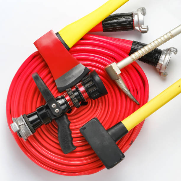 istock Yellow sledgehammer, axe, hooligan bar and fire hose from fireman's toolbox 1288175470