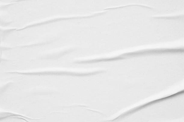 istock Blank white crumpled and creased paper poster texture background 1288177617