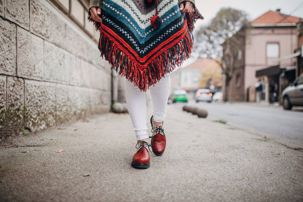 istock Fashioable woman walking on the street 1288180742
