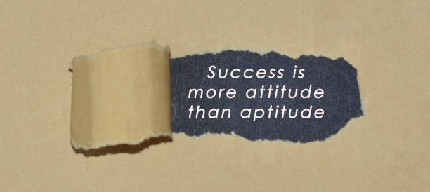 istock Motivational quote written on brown torn paper 1288188721