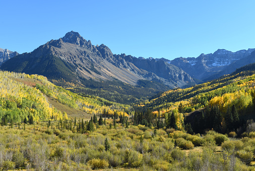 Sneffels Range of the San Juan Mountains with Mt Sneffels (14,158-foot/4315.4 m) dominating the autumn scenery. Picture taken in the Mount Sneffels Wilderness, Uncompahgre National Forest, Rocky Mountains, Colorado.