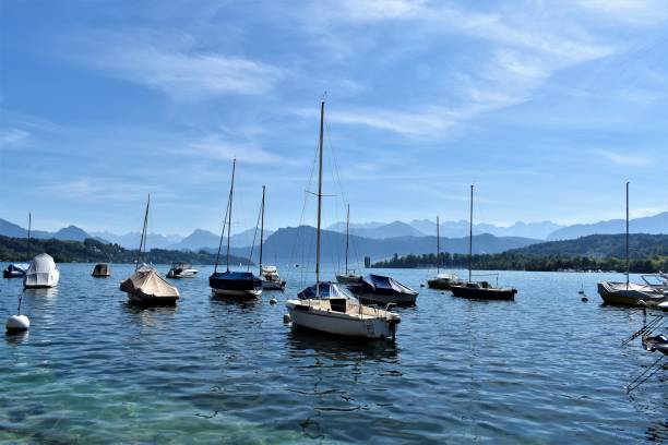 istock Switzerland Boats with Mountain Views 1288190139