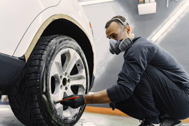 istock Male hand with foam sponge washing car 1288190265