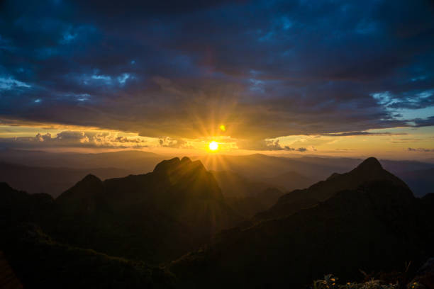 istock Peak of mountain with sunset light beam 1288192365