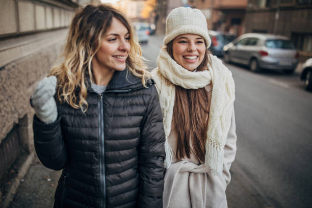 istock Two beautiful women on the street 1288194562