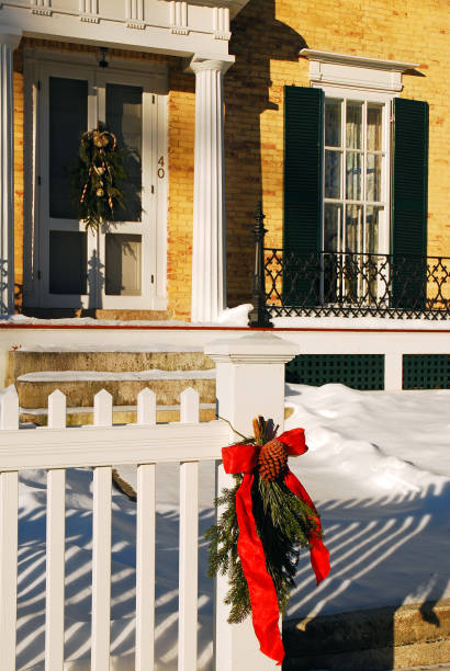 istock Christmas bow on a picket fence 1288197367
