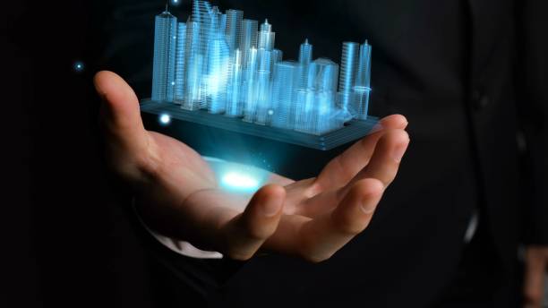 istock Businessman holds 3D city model showing augmented reality technology 1288197443