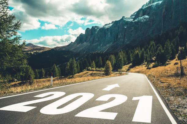istock 2021 New Year road trip travel and future vision concept . 1288198977