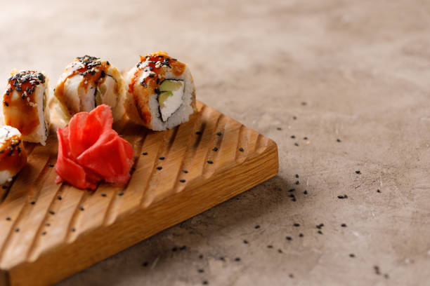 istock Appetizing rolls on a textured background. Japanese food concept. Close-up. Copy space. 1288201700