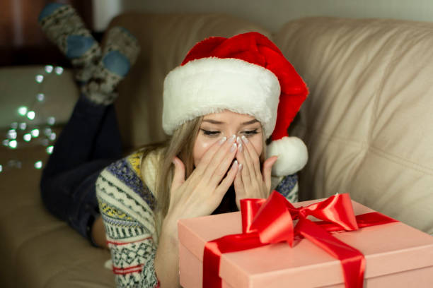 istock Beautiful blonde in a new year's image with a gift box in her hands. 1288204518