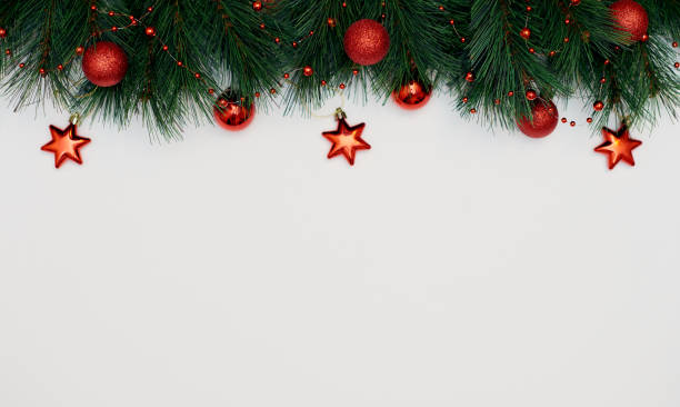 istock Christmas Border frame of tree branches with red decorations isolated on white. Christmas, New year, Festive background. Flat lay, top view, copy space. 1288204733