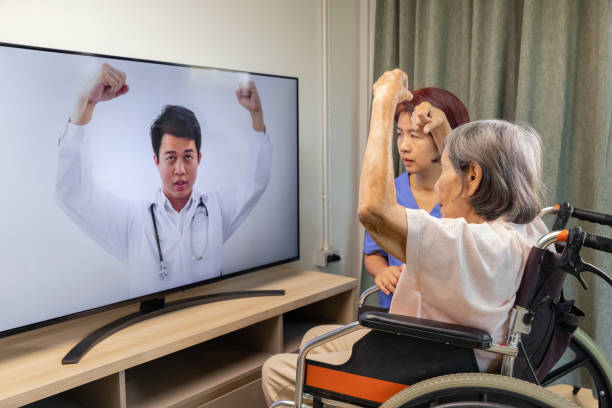 istock Elderly woman using physical therapy online service at home. 1288206620