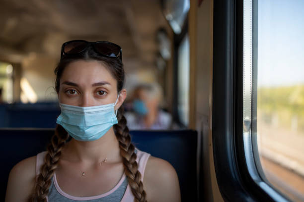 istock A girl in a protective mask in a subway car 1288208167