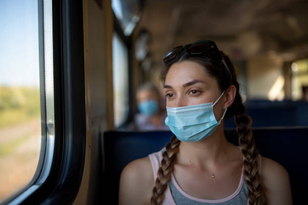 istock A girl in a protective mask in a subway car 1288208180