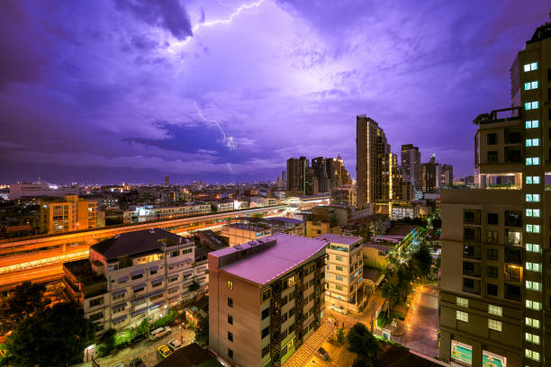 istock scenic of night.cityscape with lighting thunder on skyline 1288209240
