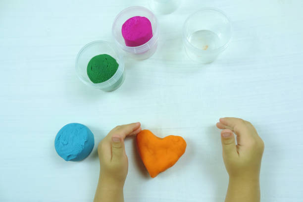 istock colored mass for modeling, decorative dough for children's creativity, baby made a heart 1288210114