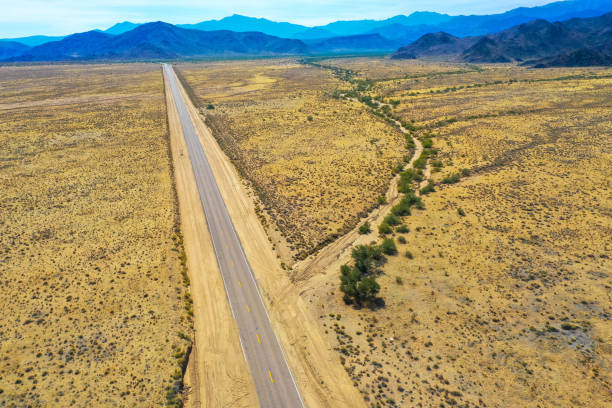 istock Panoramic drone view of a desert road in Death Valley 1288213851