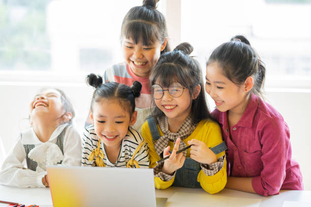 istock Children watching video on laptop 1288215979