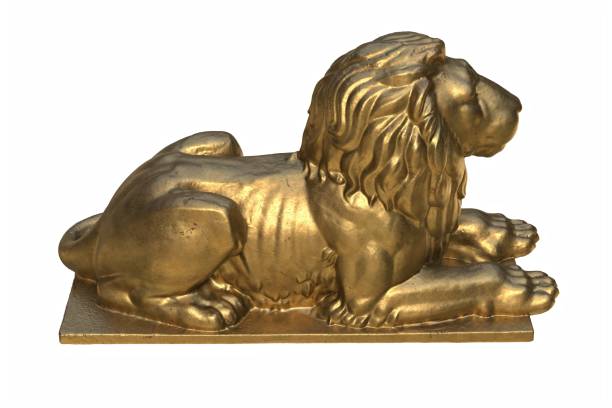 istock 3D render of lying lion gold sculpture isolated on white 1288218746