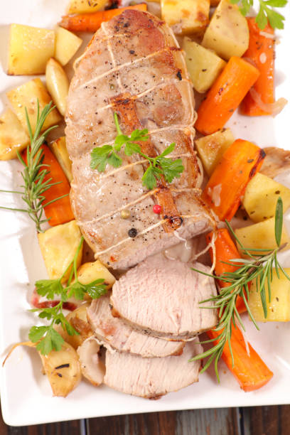 istock roasted meat slices and vegetables 1288218879