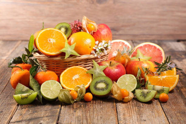istock assorted of fresh fruits on wood background 1288218886