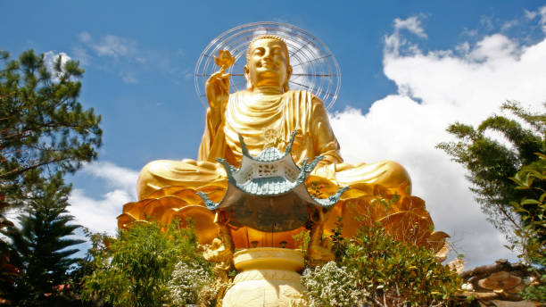 istock Front view of golden statue of Buddha 1288218971