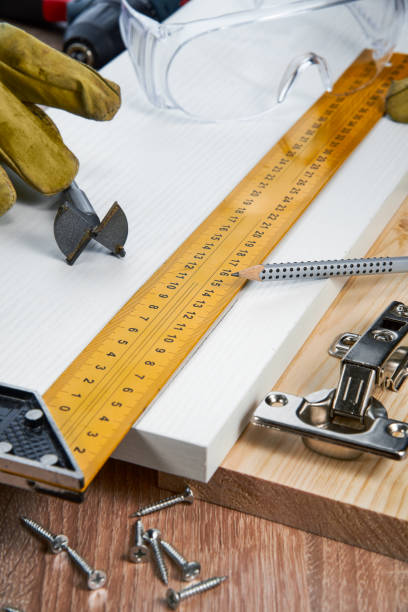 istock Installation of furniture hinges in the chipboard, tools and accessories needed to perform the work 1288219708