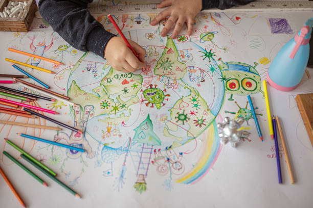 istock School boy drawing Covid-19 theme 1288220043