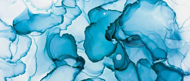 Photo of Closeup of blue alcohol ink abstract texture