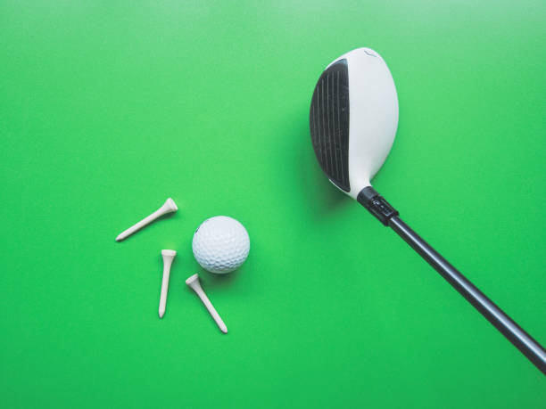istock Golf equipment flat lay on green background. Top view 1288224171