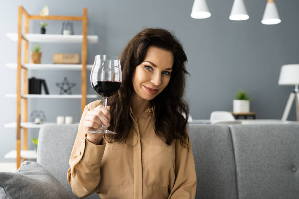 istock Woman Drinking Red Wine In Video Conference 1288224208