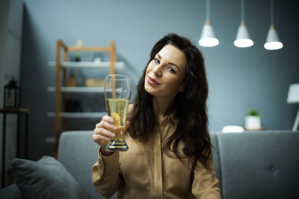 istock Woman Drinking Beverage Beer In Video Conference 1288224232