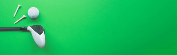 istock Golf equipment flat lay on green background. Top view 1288225177
