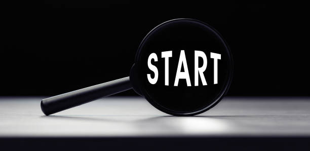 istock Magnifying glass with the word START on table 1288226636