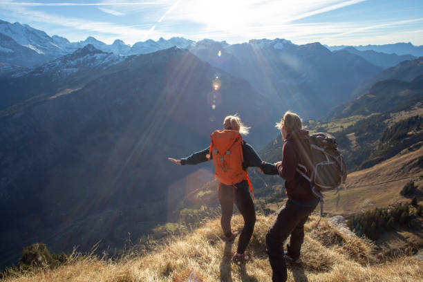 istock Hikers relax on sunny mountain ridge in the morning 1288229912