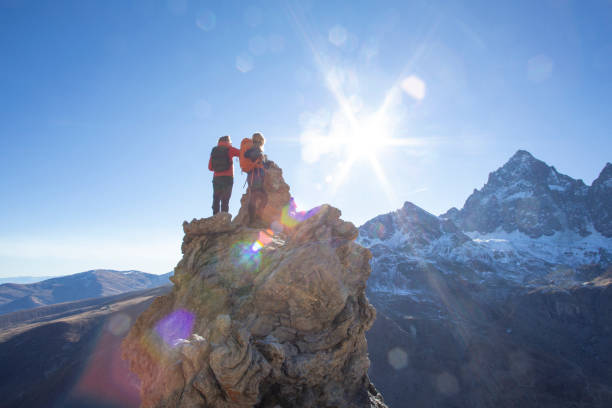 They chat and look off to distant Swiss Alps